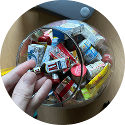 Hand reaching into a candy jar