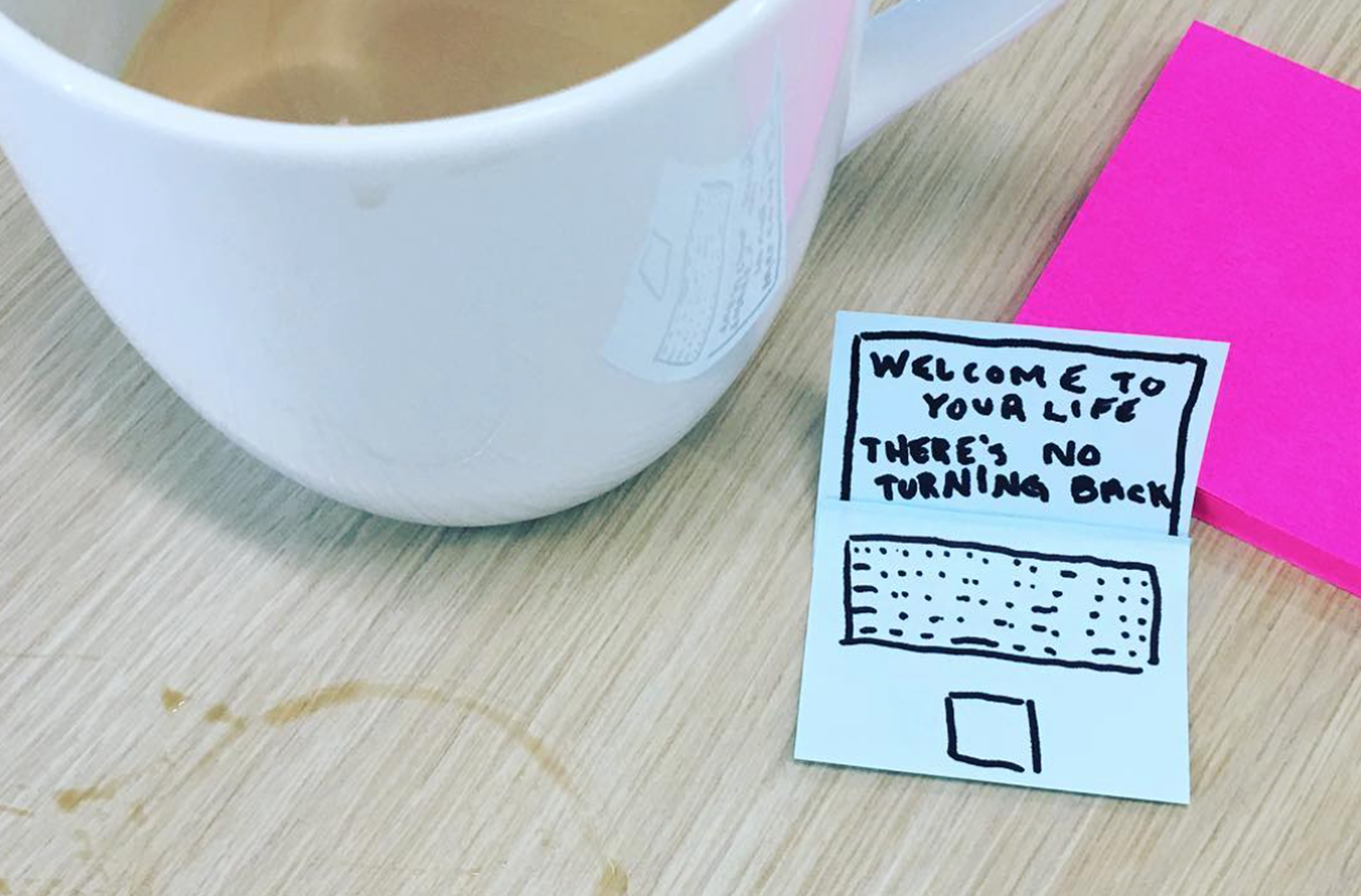 Coffee cup and 'welcome to your life' sketch